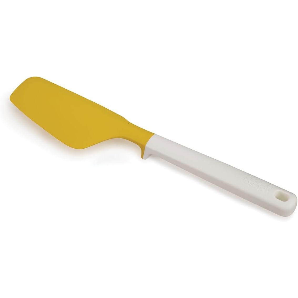 Espátula para huevos amarillos Joseph Joseph Elevate, ergonómica y ideal para cocinar fácilmente.