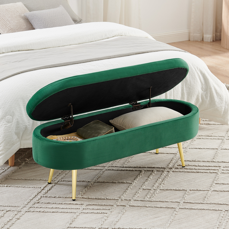 Banquette coffre ovale en velours vert foncé avec rangement intérieur