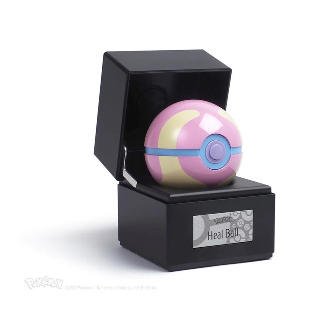 Wand Company - Réplica diecast Heal Ball de Pokémon WRC15521 para coleccionistas mayores de 14 años, diámetro 8 cm, acabado brillante y presentador incluido
