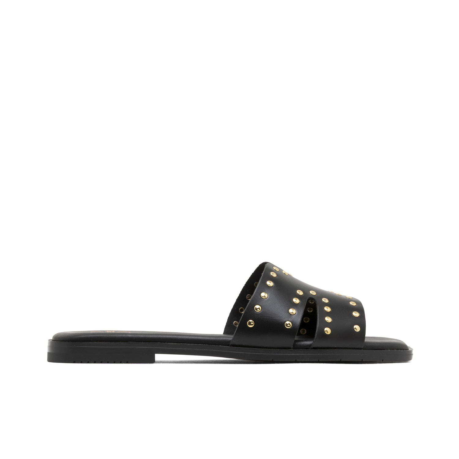 Sandalias planas de piel Becca en negro, destalonadas con pala en H y tachuelas metálicas para un estilo moderno y llamativo. Confort garantizado gracias a la plantilla de piel acolchada y estabilidad