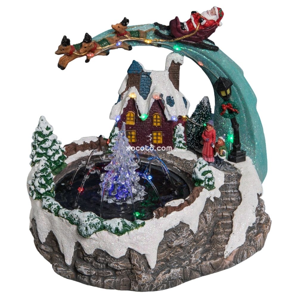 New Planet Home® Escena de navidad "Peterhof" Pueblo de navidad luminoso con Fuente, árbol y Papá-Noel con renos | 25x19x21 cm