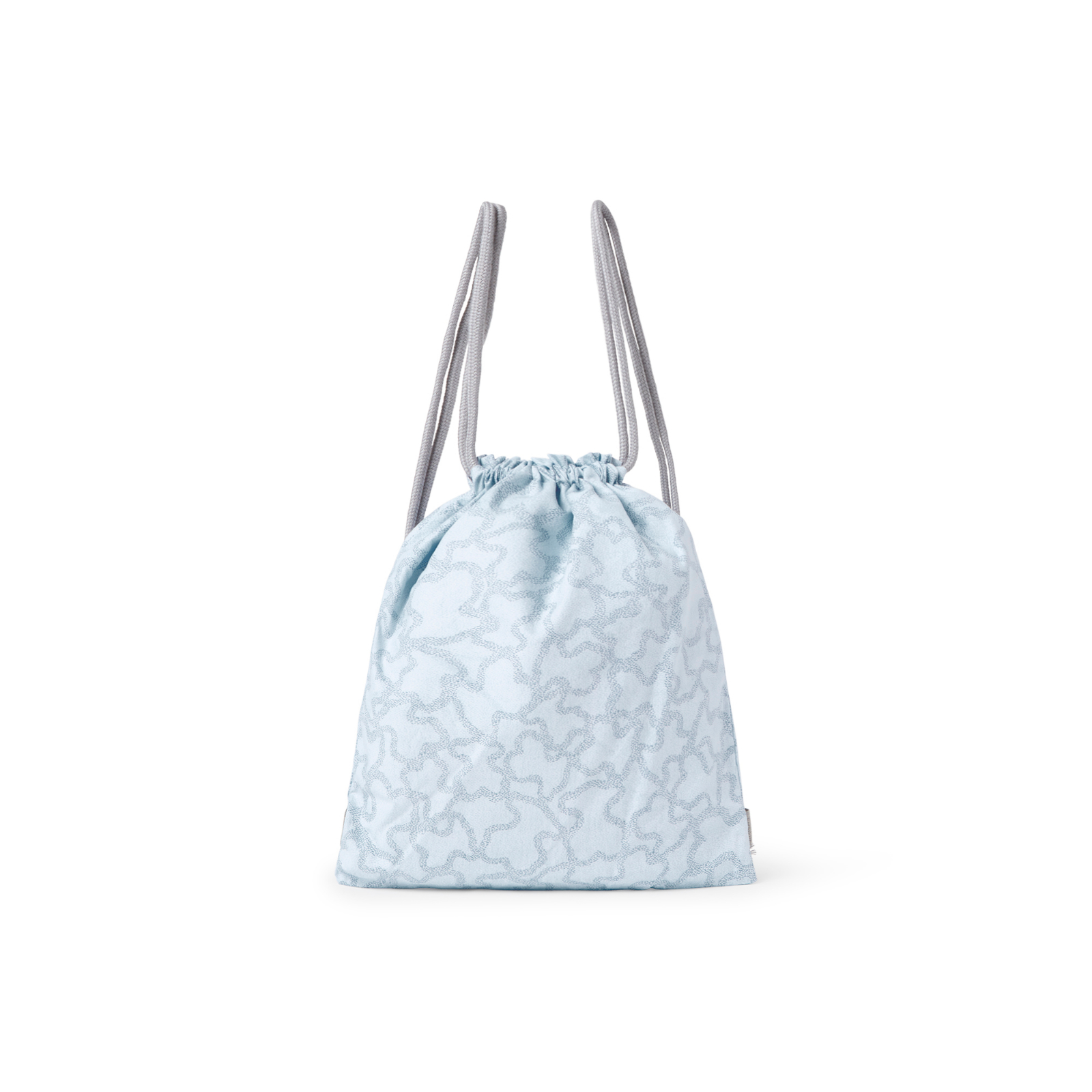 Bolsa para la guardería TOUS Baby, con una pequeña asa central y cierre con cordones.