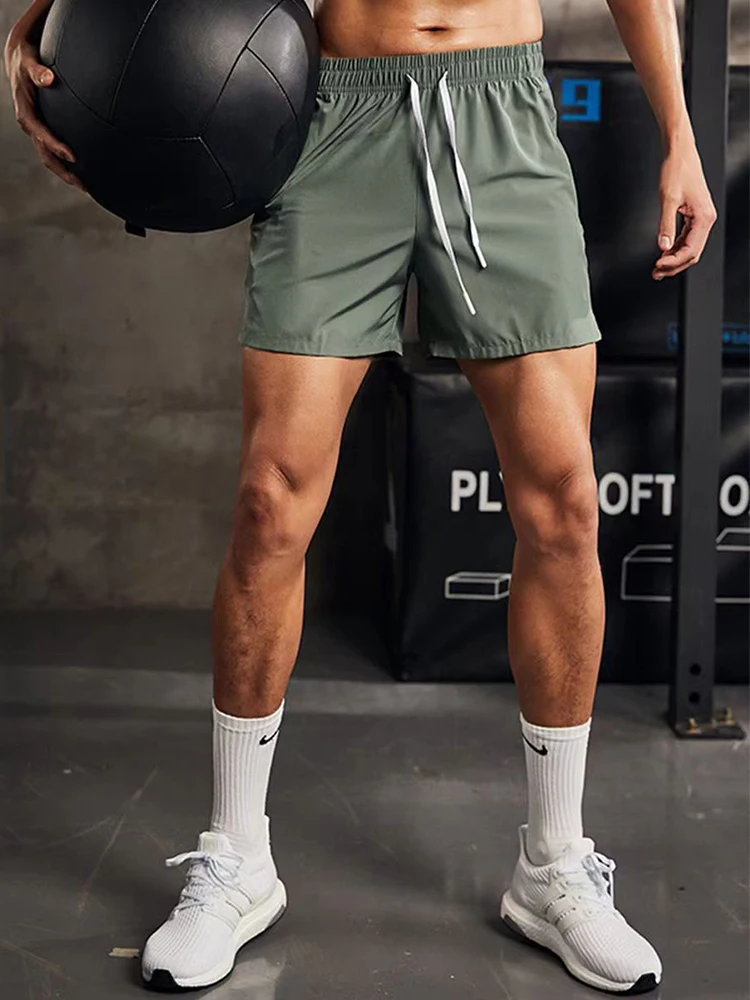 LECOONMX Shorts Deportivos para Hombre Diseño de Malla Lateral